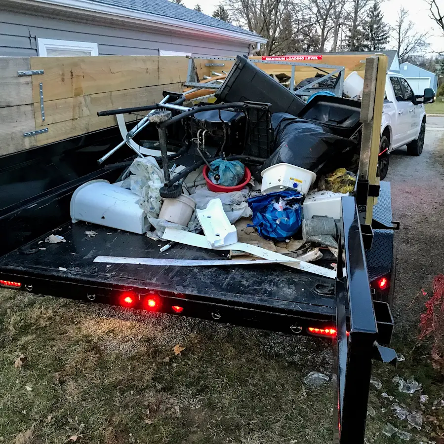Roll-off dumpster delivered to a residential driveway in Swartz Creek